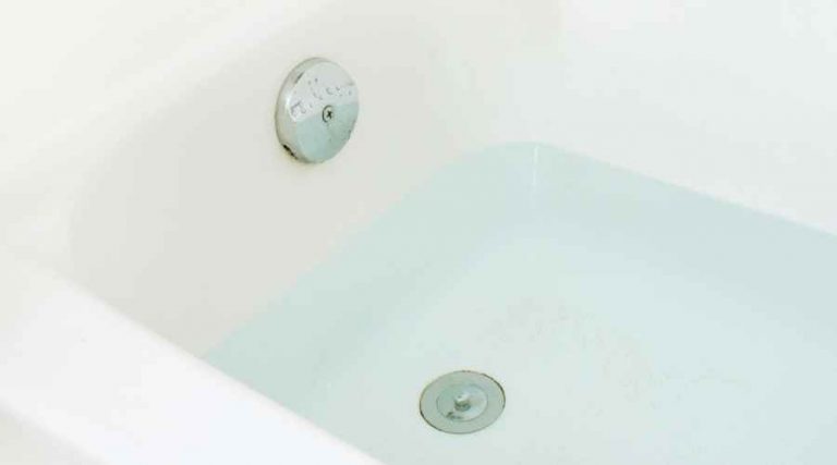 bathtub drain under clear water